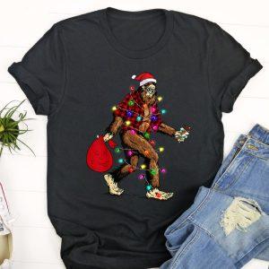 Ugly Christmas T Shirt, Bigfoot Carrying Christmas…